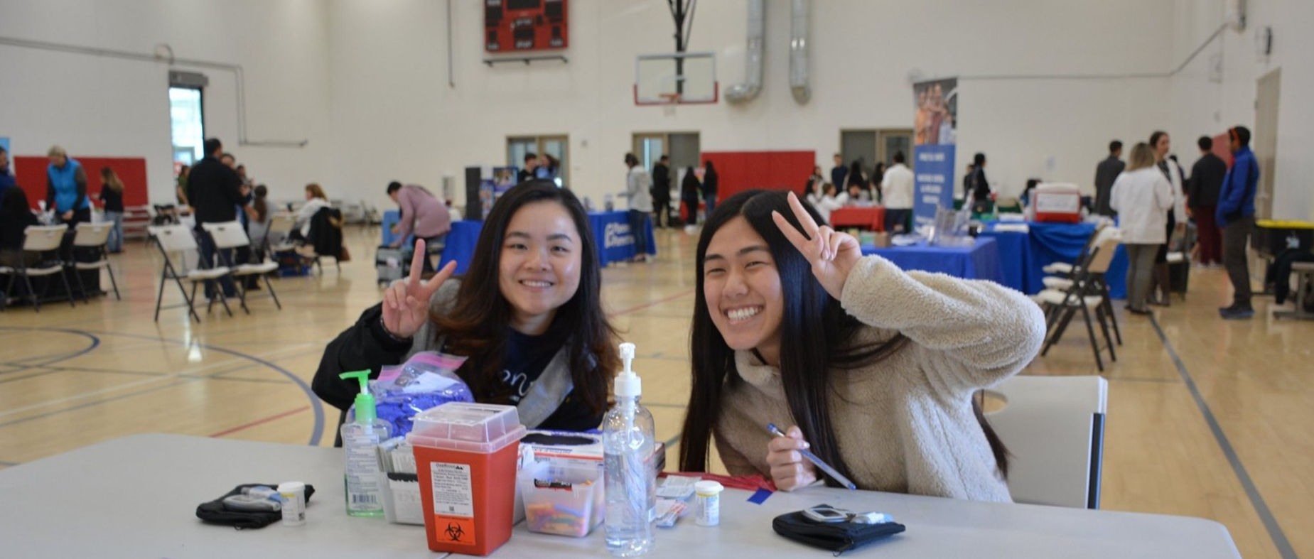 MEMO volunteers gathered at a community outreach event